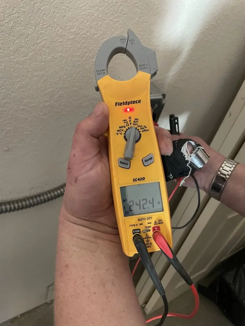 Voltage testing with clamp meter during Aluminum Wiring Replacement in Leo-Cedarville